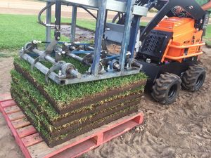 Bullseye Machine - Laying Harvest on Pallet Green Life Turfs patented Bullseye Instant Grass turf farmed and delivered on pallets