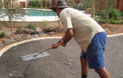 Levelling top soil in preparation for laying turf